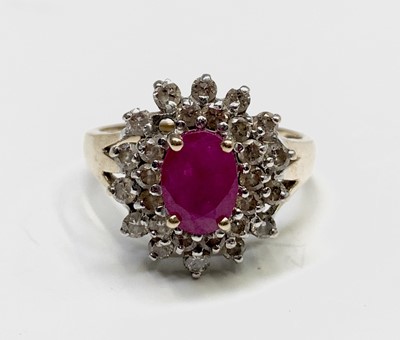 Lot 115 - A 9ct gold ring with an oval ruby and diamond...