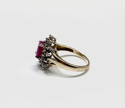 Lot 115 - A 9ct gold ring with an oval ruby and diamond...
