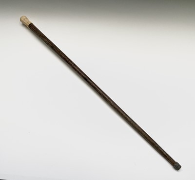 Lot 73 - An Art Deco palm wood walking cane, with...
