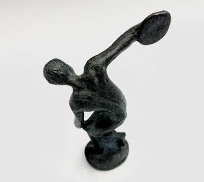Lot 60 - A small bronze figure of an athlete throwing a...