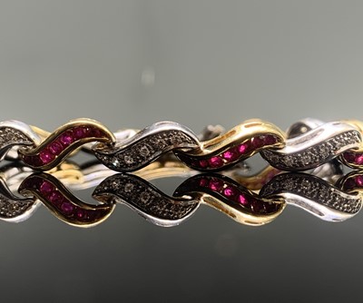Lot 287 - An 18ct yellow and white gold ruby and diamond...
