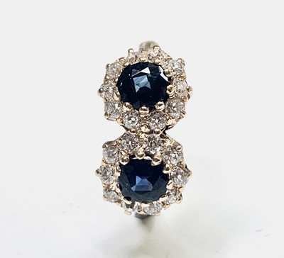 Lot 19 - A yellow gold double diamond and sapphire...