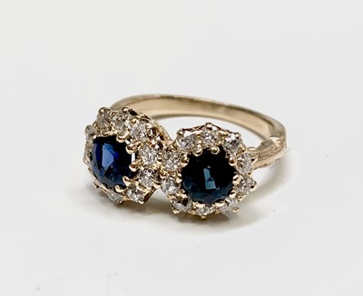 Lot 19 - A yellow gold double diamond and sapphire...