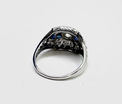 Lot 142 - A Sophia platinum diamond and sapphire ring 4.1gm