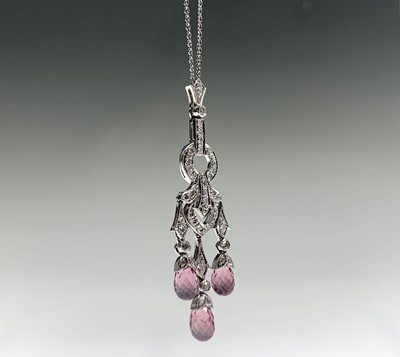 Lot 66 - An 18ct white gold pendant and chain set with...