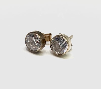 Lot 171 - A pair of white stone set ear studs