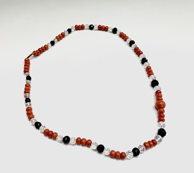Lot 342 - A red coral bead necklace arranged in groups...