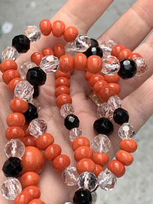 Lot 342 - A red coral bead necklace arranged in groups...