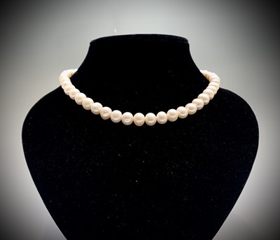Lot 24 - Cultured pearls - three necklaces and a...
