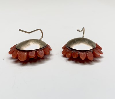 Lot 434 - A pair of flowerhead carved red coral earrings...