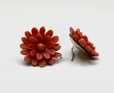 Lot 434 - A pair of flowerhead carved red coral earrings...