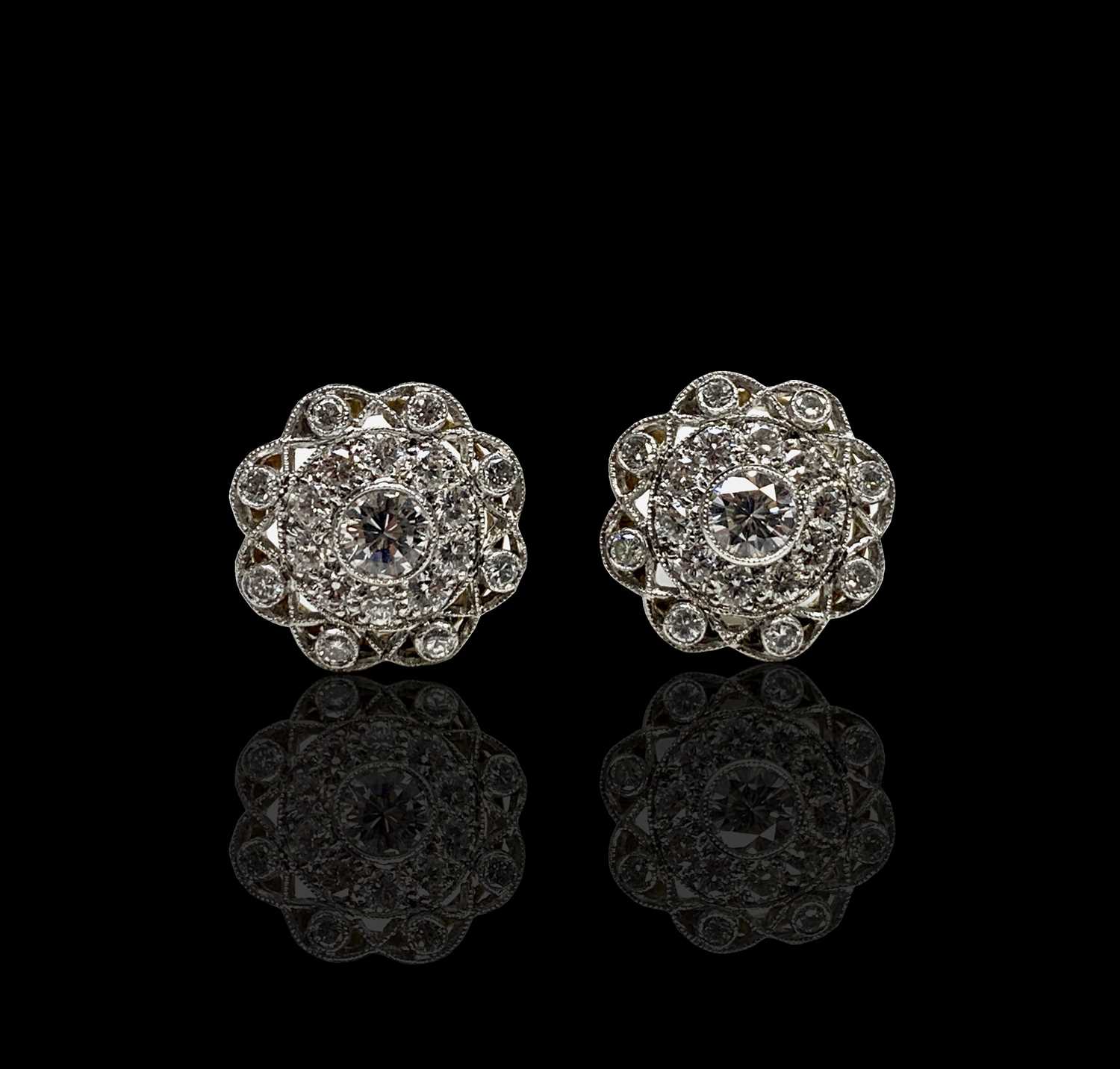 Lot 195 - A pair of Belle Epoch diamond set discus...