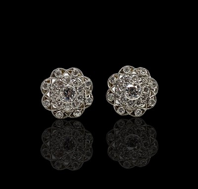 Lot 195 - A pair of Belle Epoch diamond set discus...