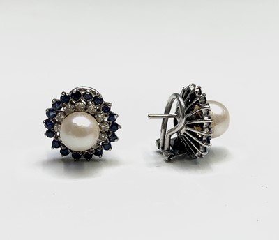 Lot 80 - A pair of 18ct white gold earrings each with a...