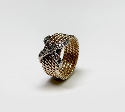 Lot 373 - An Era 14ct gold rope coil ring with a cross...