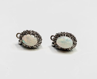 Lot 324 - A pair of opal and diamond earrings 3gm