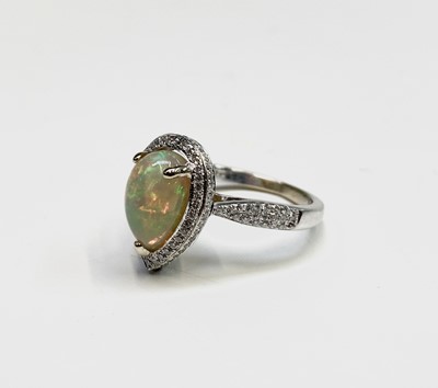 Lot 133 - An 18ct white gold ring set a pear shape opal...