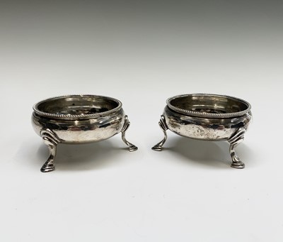 Lot 1074 - A pair of George III open salts with beaded...