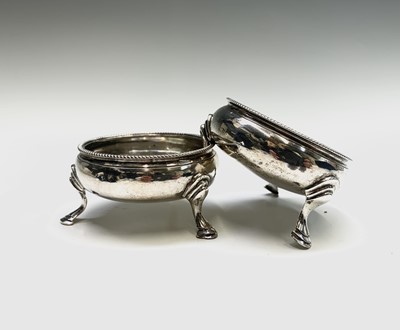 Lot 1074 - A pair of George III open salts with beaded...