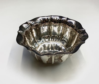 Lot 1045 - An Edwardian fluted and engraved silver sugar...