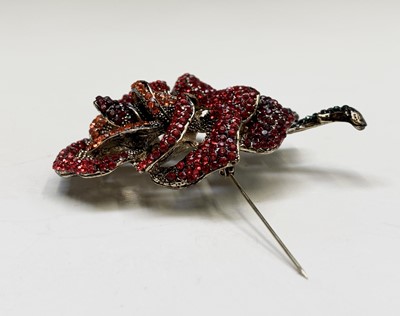 Lot 186 - A costume jewellery, red rose crystal brooch...
