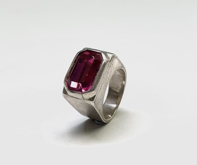 Lot 44 - A signet style silver ring set a fuchsia pink...