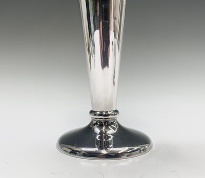 Lot 1010 - A pair of silver vases, the necks with chased...