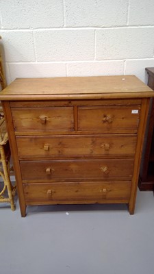 Lot 11 - Pine chest of two short and three long drawers...