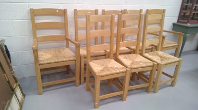 Lot 31 - Eight light oak ladder back chairs with rush...