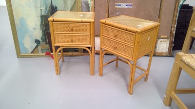 Lot 32 - Two glass top cane and wicker bedside drawers...