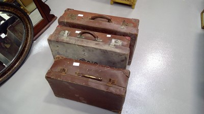 Lot 46 - Three vintage leather suitcases.