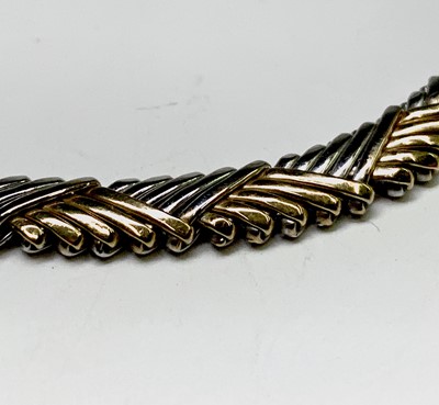 Lot 258 - A contemporary 18ct two-colour gold weave...