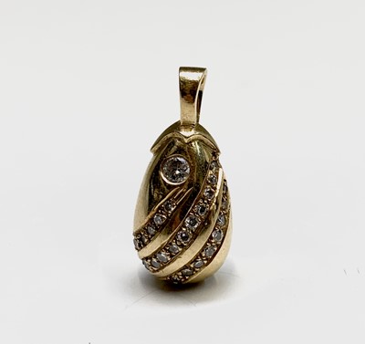 Lot 174 - A pretty diamond set gold drop shaped pendant,...