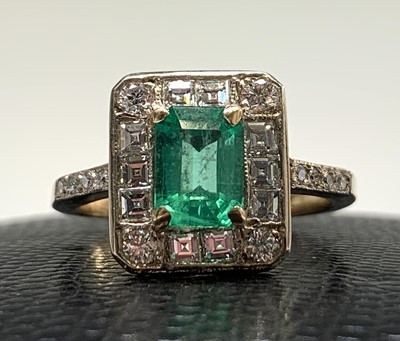 Lot 112 - An emerald and diamond ring the principal...