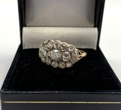 Lot 114 - A Victorian style oval diamond ring set in...