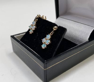 Lot 224 - Two pairs of opal earrings set in gold 3.2gm