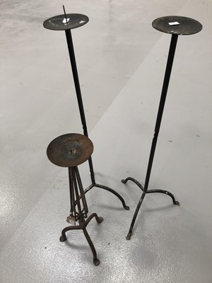 Lot 96 - A pair of wrought iron candle holders height...