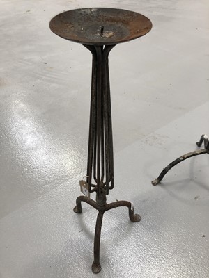 Lot 96 - A pair of wrought iron candle holders height...