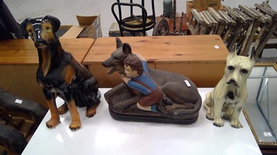 Lot 62 - A trio of ceramic dogs.