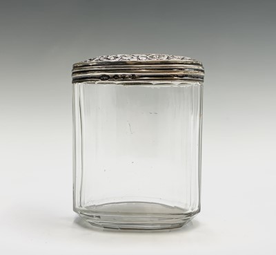 Lot 1051 - Four cut glass toilet jars each with silver...