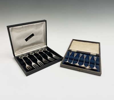 Lot 1072 - A set of six silver coffee spoons each has a...