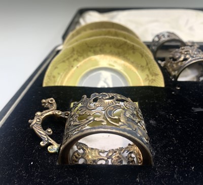 Lot 1009 - Five late Victorian silver coffee cup holders...