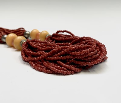 Lot 318 - A coral and imitation amber necklace.