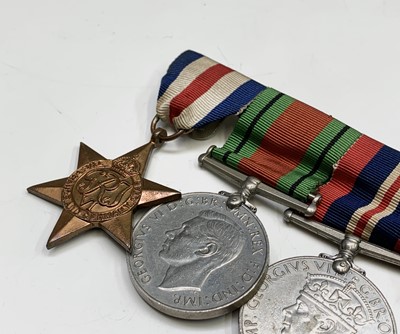 Lot 210 - A Meritorious service family group to the...