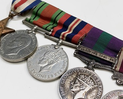 Lot 210 - A Meritorious service family group to the...
