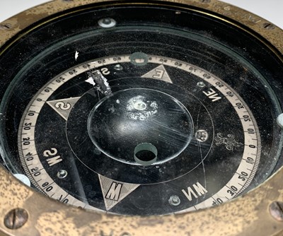Lot 49 - A brass ship's compass, stamped to the edge...