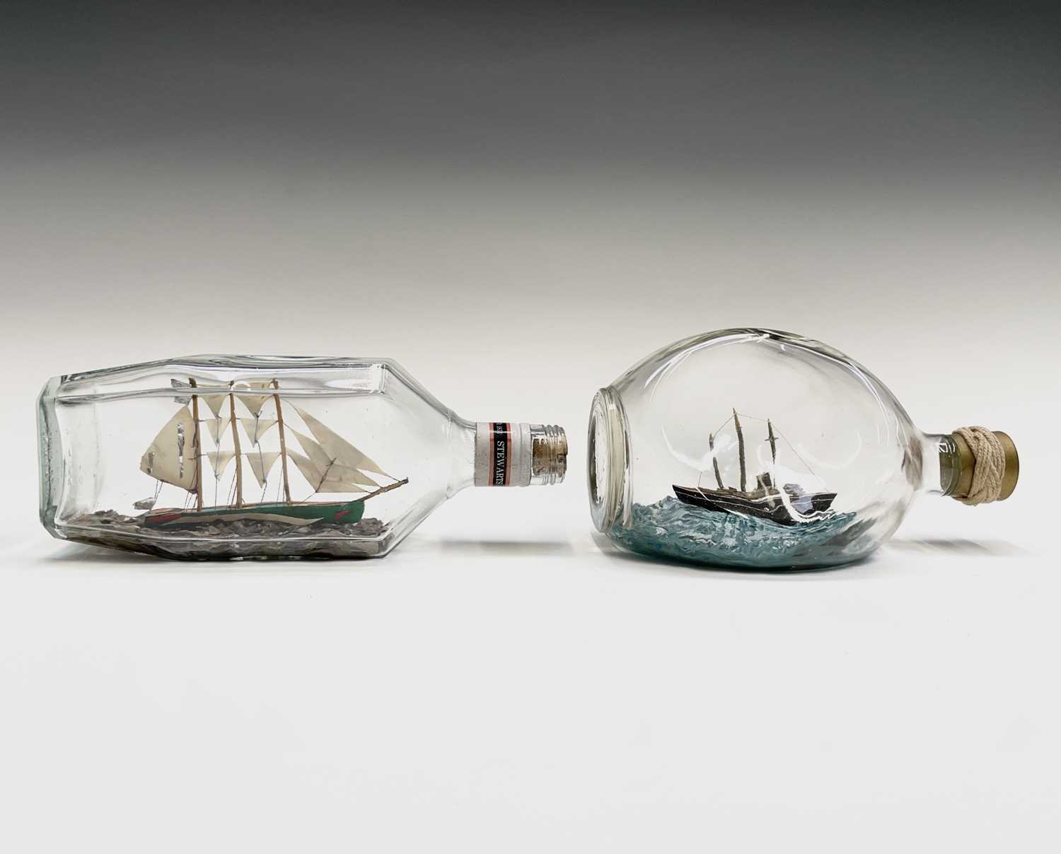 Lot 68 - A model three masted ship in a bottle, length...