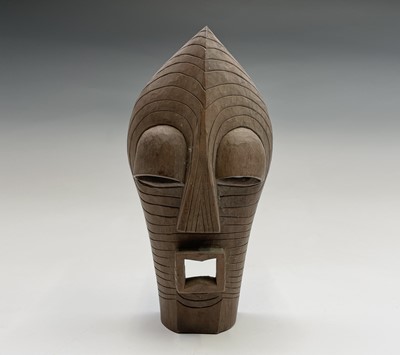 Lot 87 - An African tribal hardwood mask, carved with...