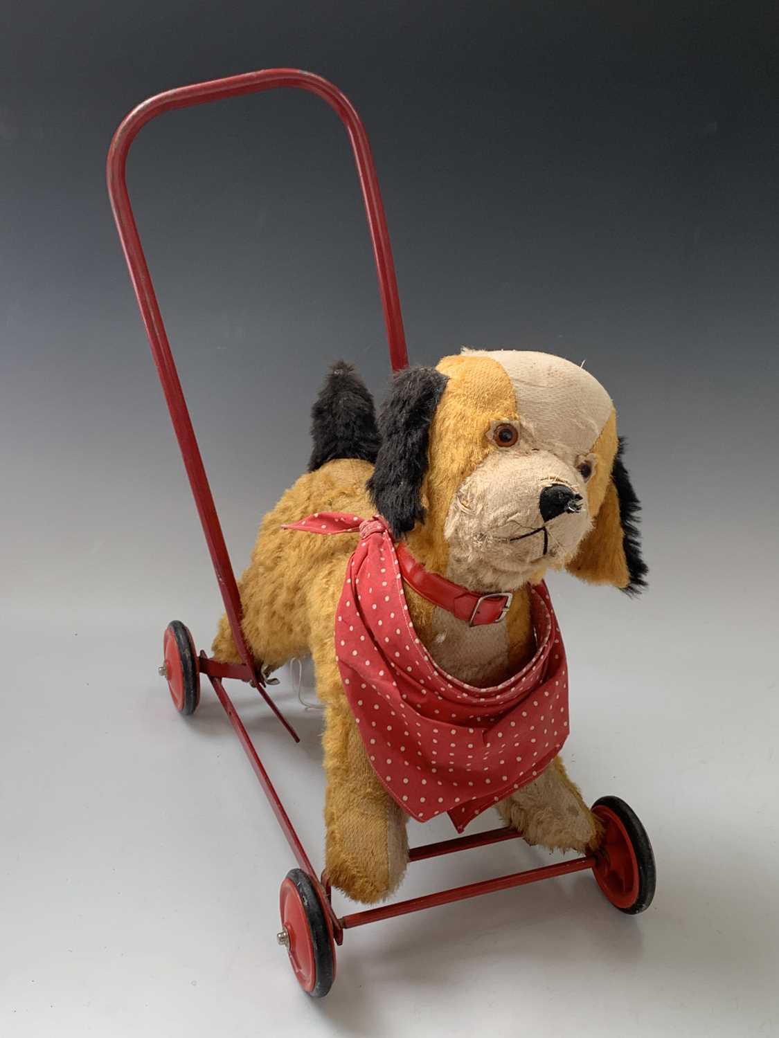 Lot 765 - Chiltern Toys Push Along Dog - A somewhat...