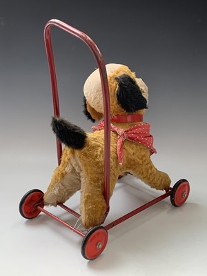 Lot 765 - Chiltern Toys Push Along Dog - A somewhat...